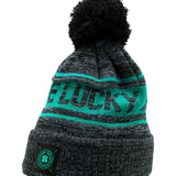 "Lucky Baller" beanie from Black Clover featuring, a ultramarine striped design, a cuff, and fluffy black pom-pom on top