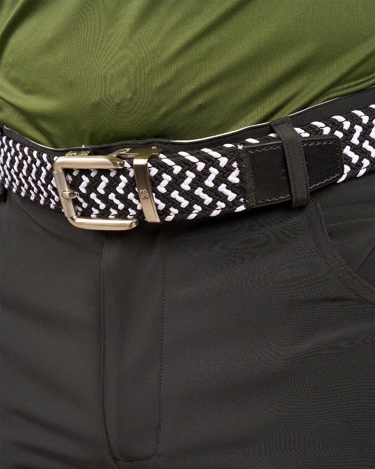 Man wearing black and white stretch belt from Black Clover