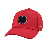 Bold, red hat from Black Clover featuring premium style and craftmanship. It features an embroidered black clover icon, and the words "Live Lucky" on the side.