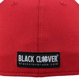 Bold, red hat from Black Clover featuring premium style and craftmanship. It features an embroidered black clover icon, and the words "Live Lucky" on the side.