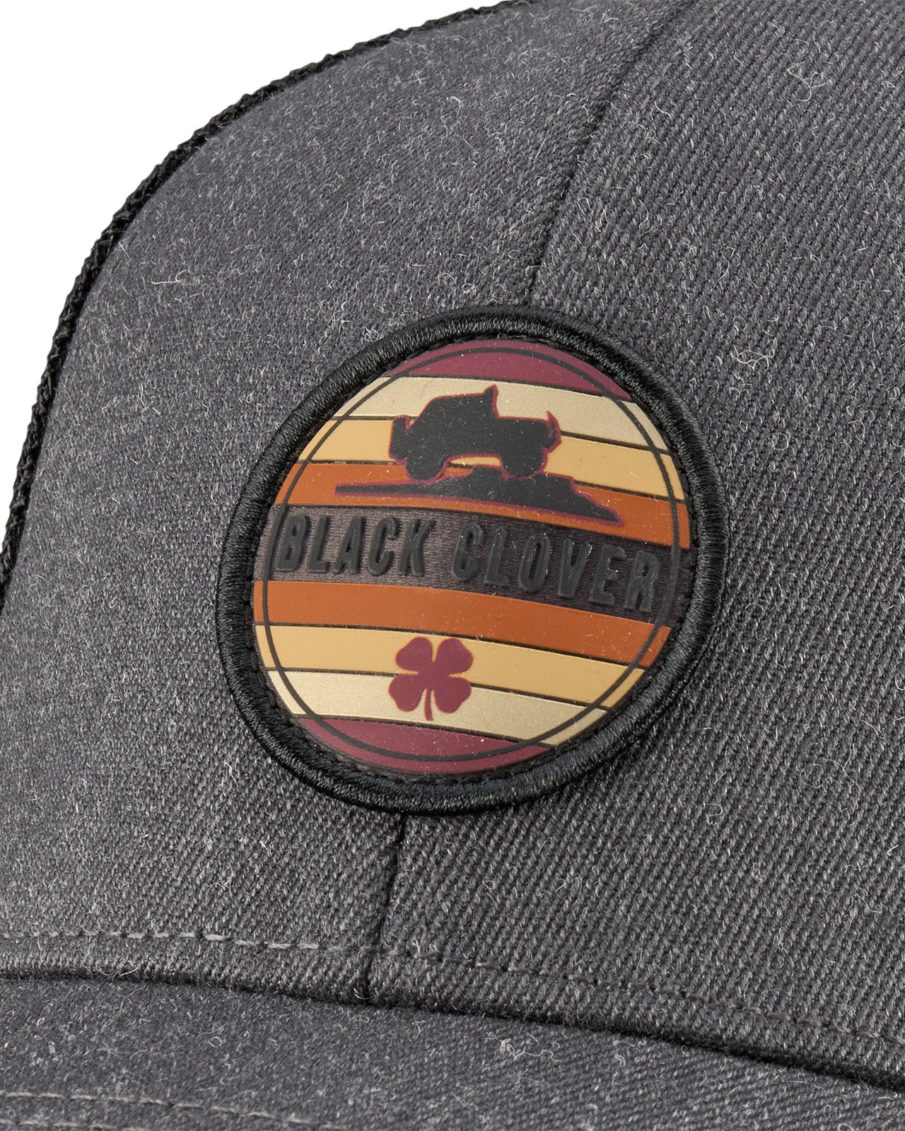 Grey hat with patch depicting vehicle offroad