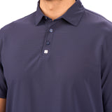 Man wearing navy polo from Black Clover with a small clover near the buttons