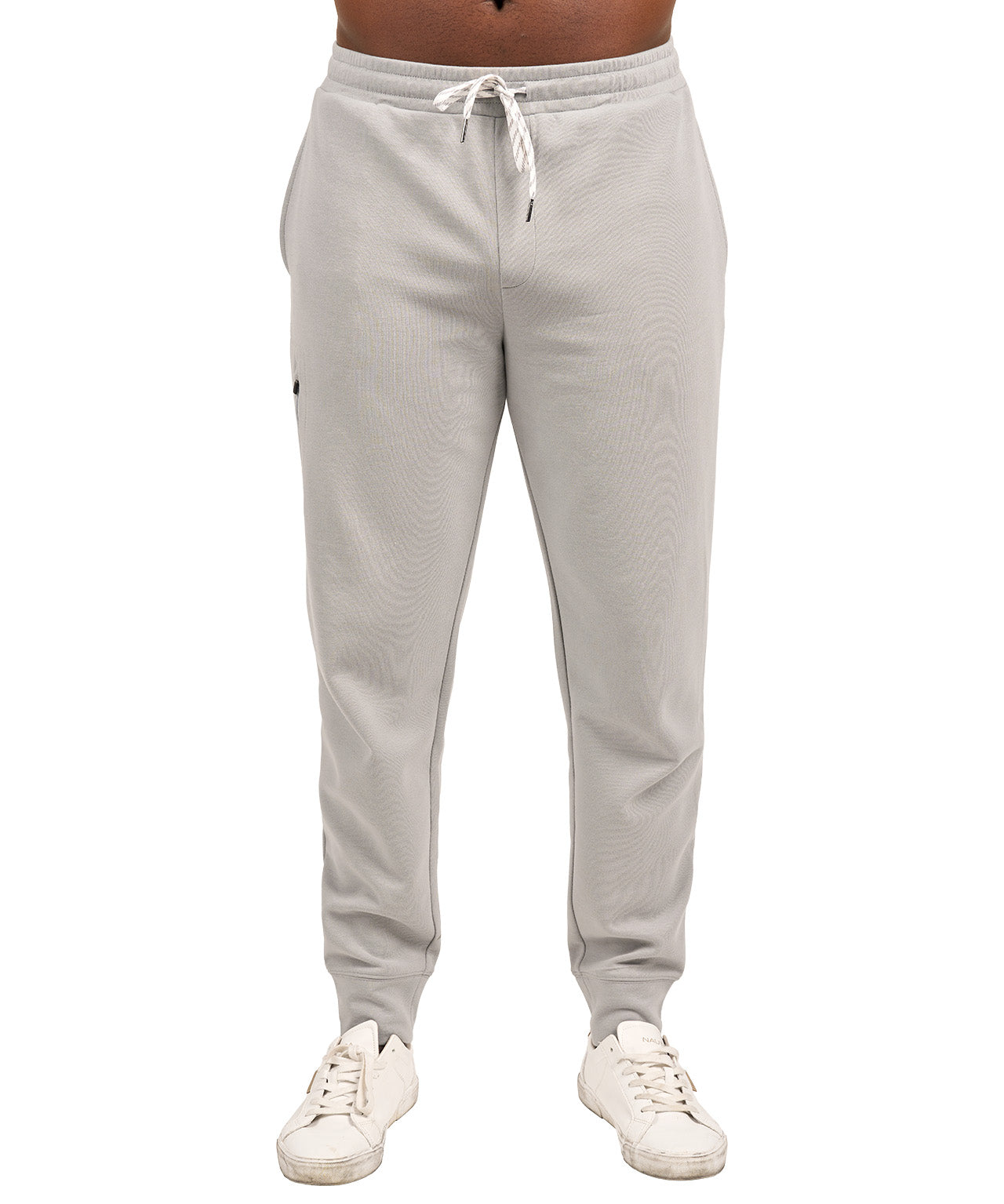 Man wearing light grey sweat pants joggers from black clover