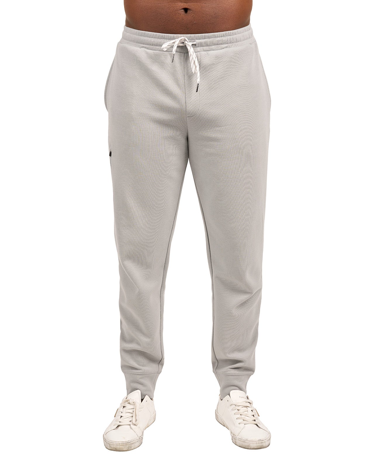 Man wearing light grey sweat pants joggers from black clover
