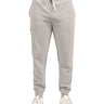 Man wearing light grey sweat pants joggers from black clover