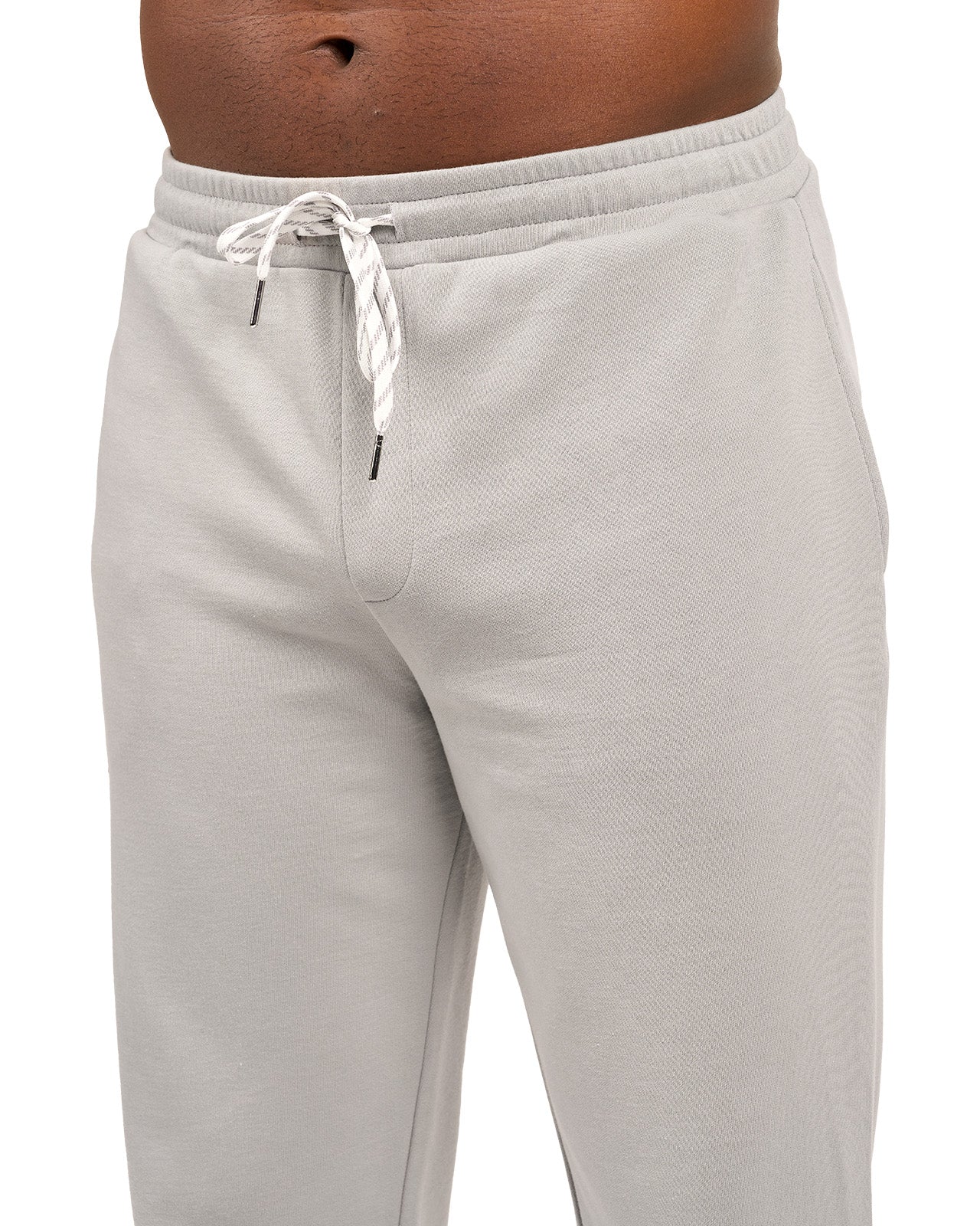 Man wearing light grey sweat pants joggers from black clover