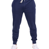 Man wearing navy sweat pants joggers from black clover