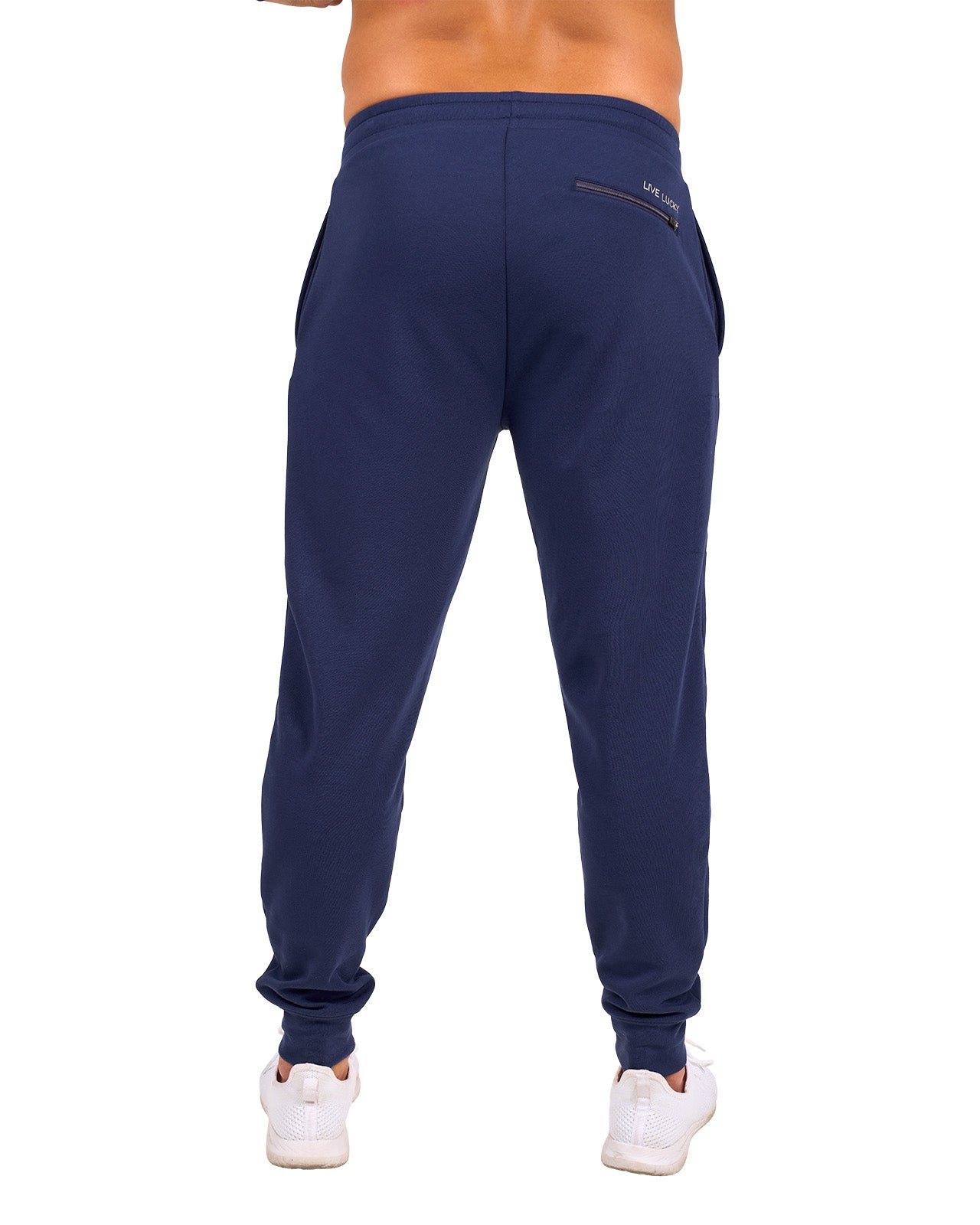 Man wearing navy sweat pants joggers from black clover