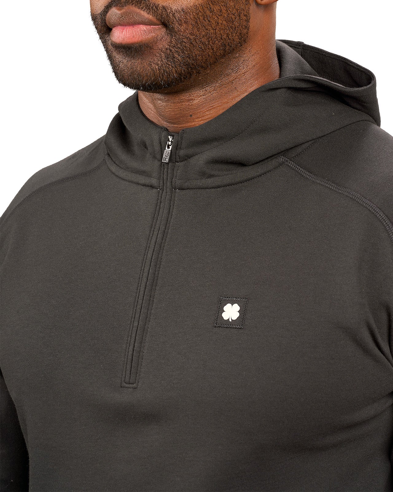 black hoodie with Black Clover logo on chest