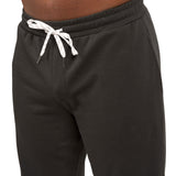 Man wearing black sweat pants joggers from black clover