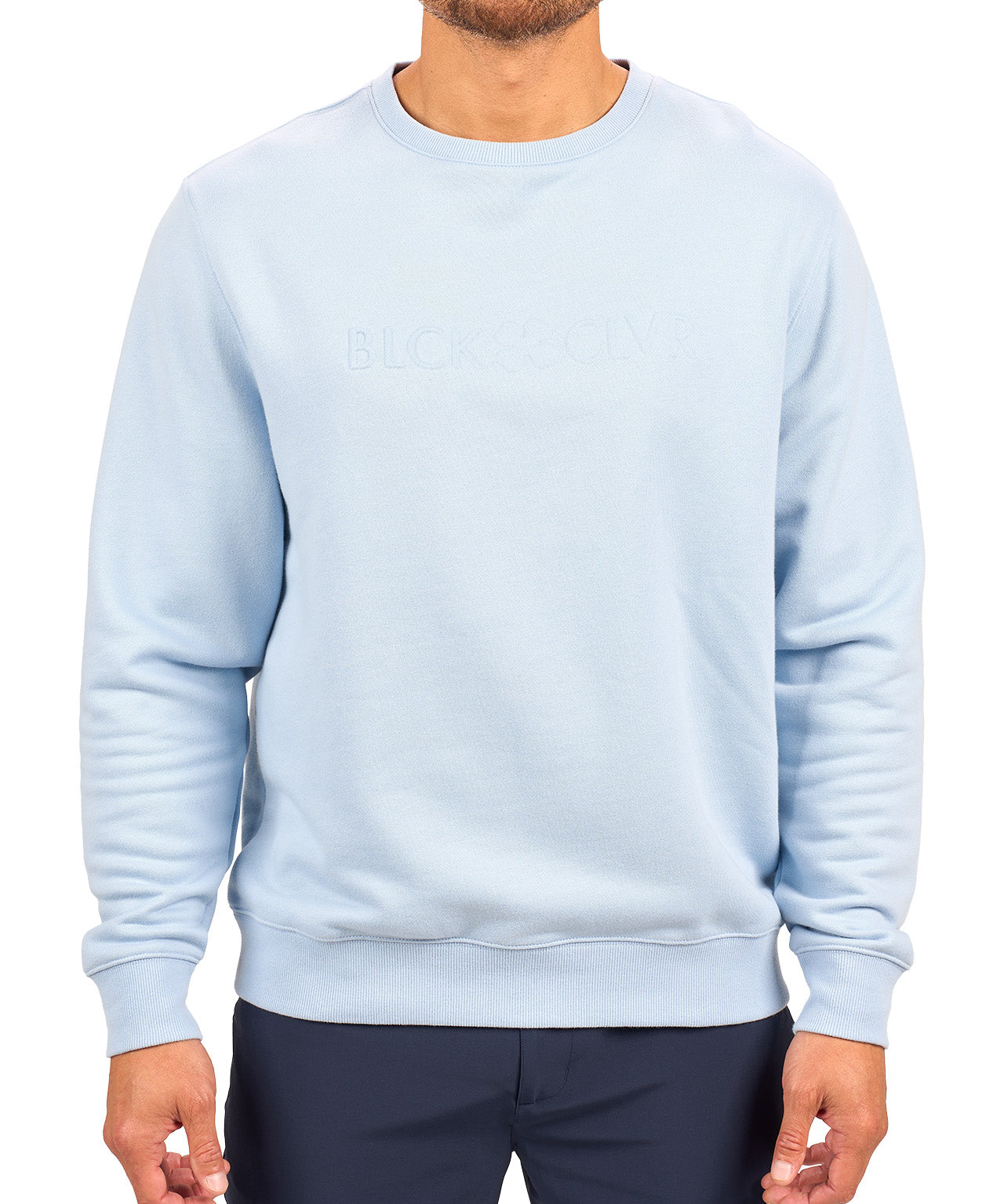 man wearing an light blue colored sweater from Black Clover with a 3d text BLCK CLVR on the chest