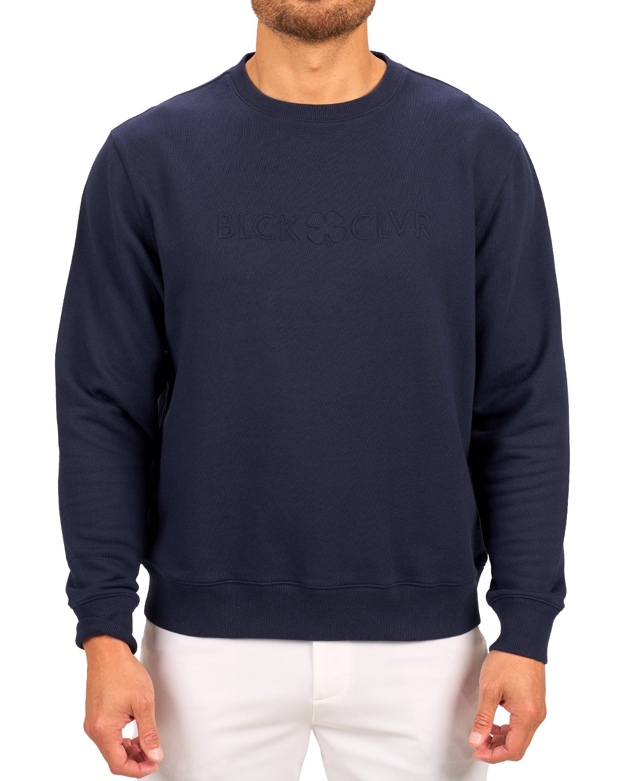 man wearing an navy colored sweater from Black Clover with a 3d text BLCK CLVR on the chest