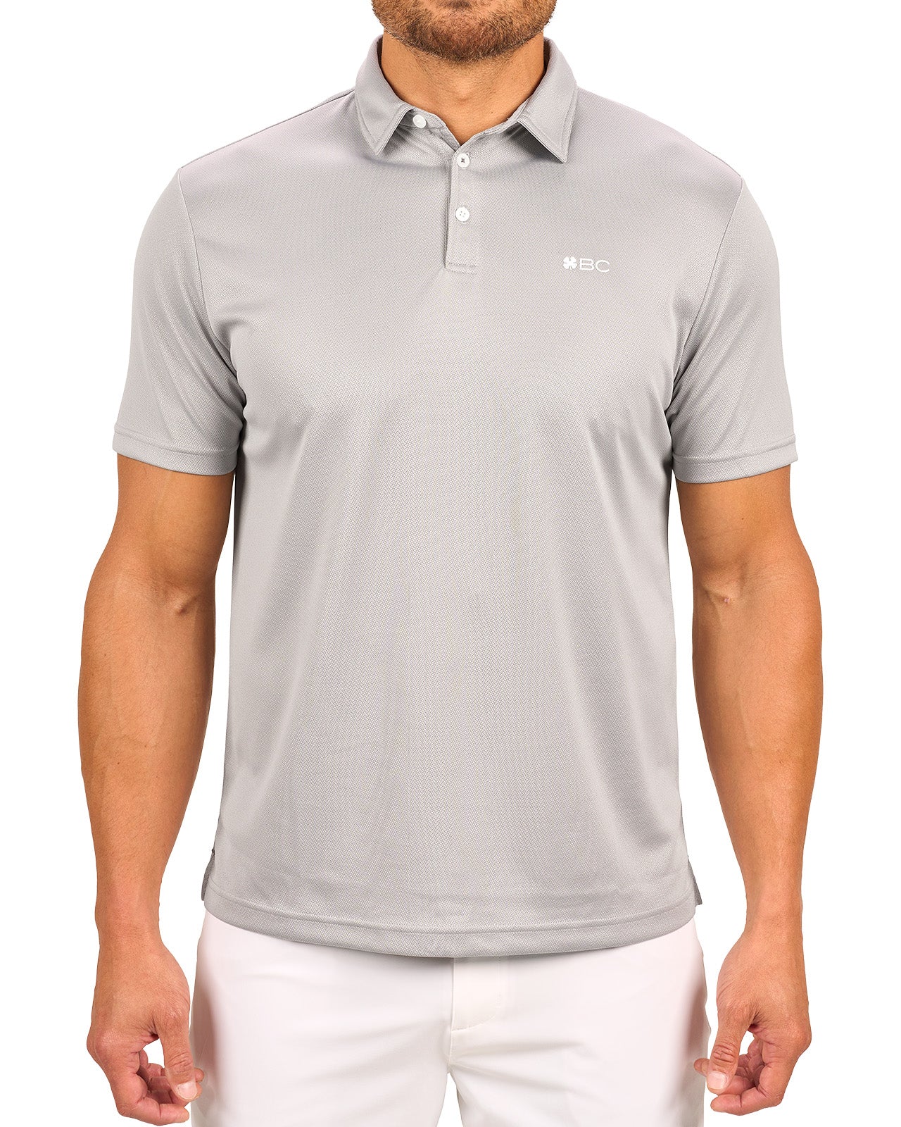 Man wearing a light grey polo from Black Clover with a small BC logo on the left chest