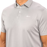 Man wearing a light grey polo from Black Clover with a small BC logo on the left chest