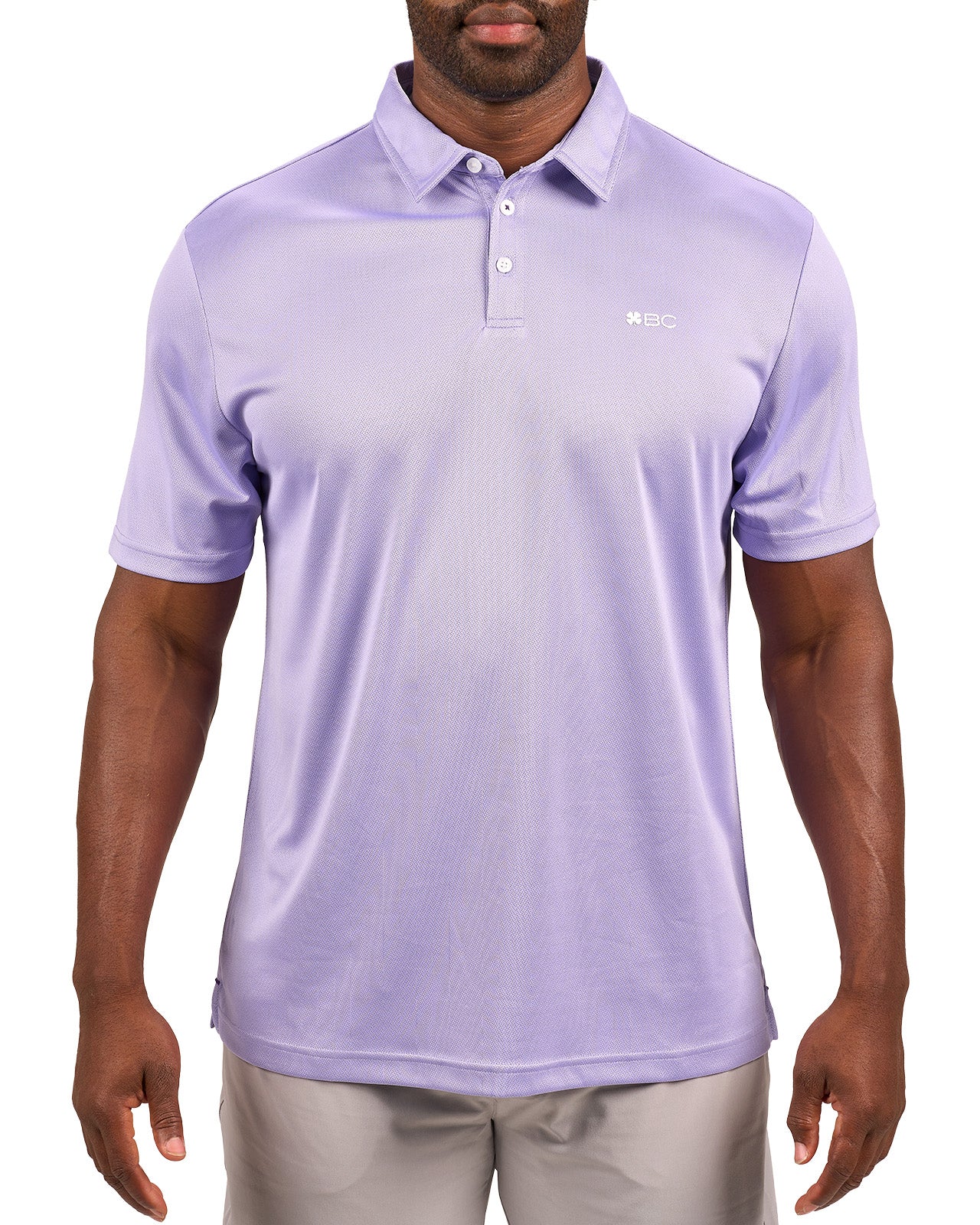 Man wearing a light purple polo from Black Clover with a small BC logo on the left chest