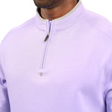 Man wearing a light purple quarter zip sweater from Black Clover featuring a small clover below the zipper