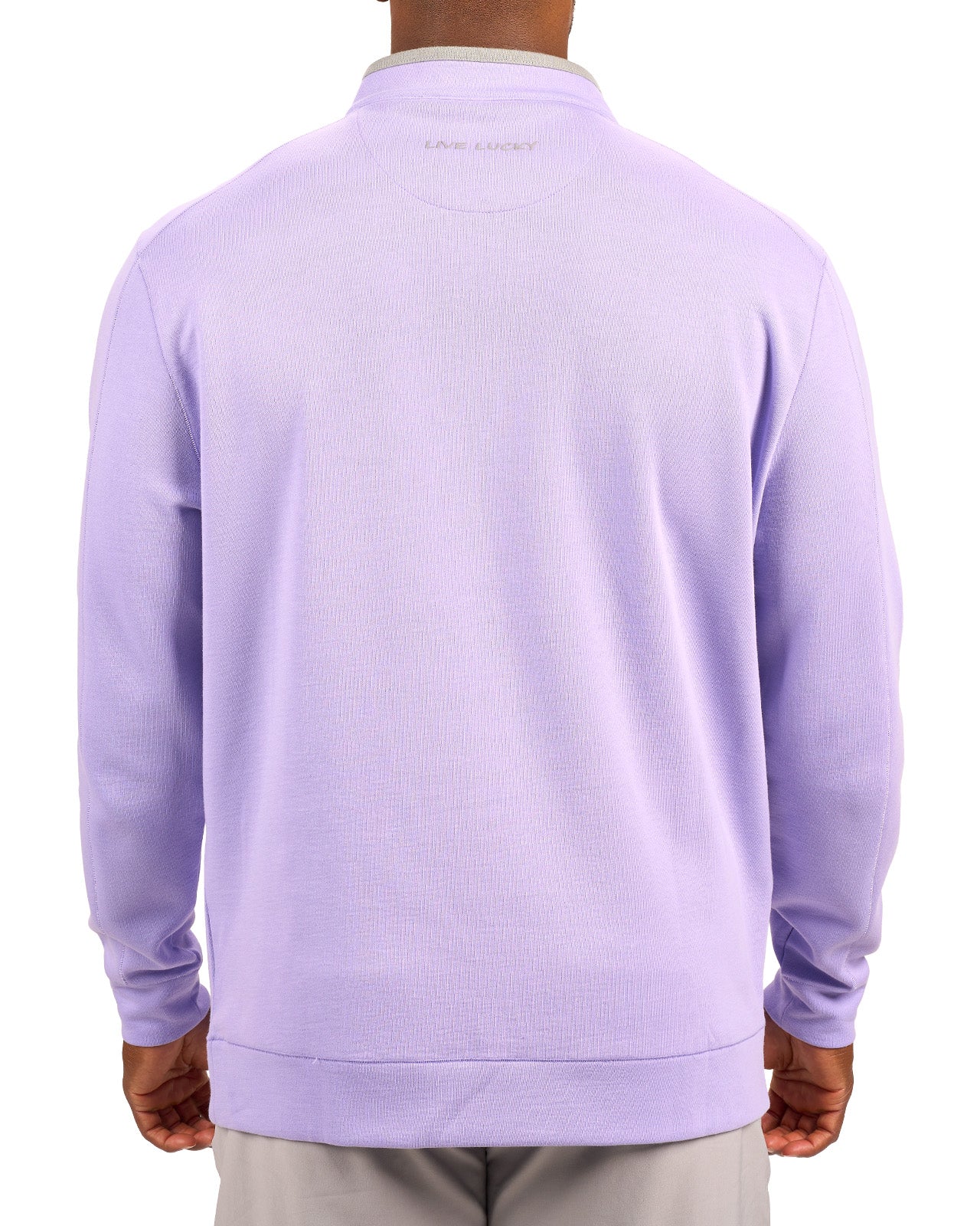 Man wearing a light purple quarter zip sweater from Black Clover featuring a small clover below the zipper