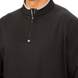 Man wearing a black quarter zip sweater from Black Clover featuring a small clover below the zipper