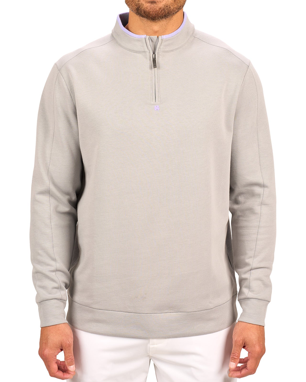 Man wearing a light grey quarter zip sweater from Black Clover featuring a small clover below the zipper