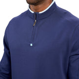 Man wearing a navy quarter zip sweater from Black Clover featuring a small clover below the zipper