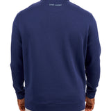 Man wearing a navy quarter zip sweater from Black Clover featuring a small clover below the zipper