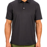 Man wearing black polo from black clover featuring a small clover logo below the bottom button