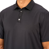 Man wearing black polo from black clover featuring a small clover logo below the bottom button