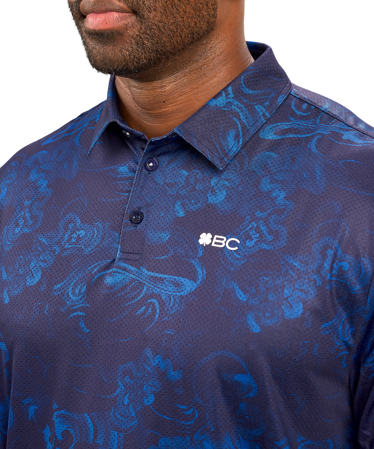 Man wearing blue polo with unique pattern from Black Clover 