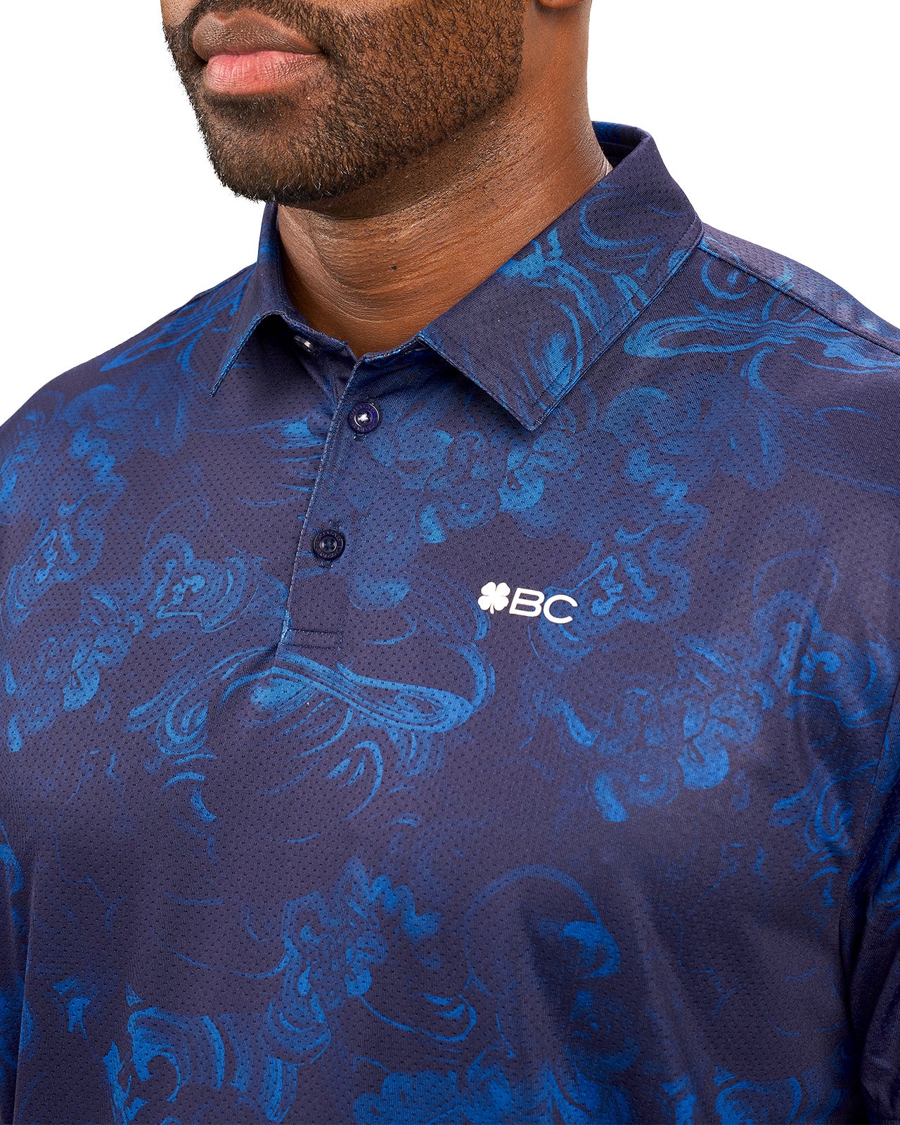 Man wearing blue polo with unique pattern from Black Clover 