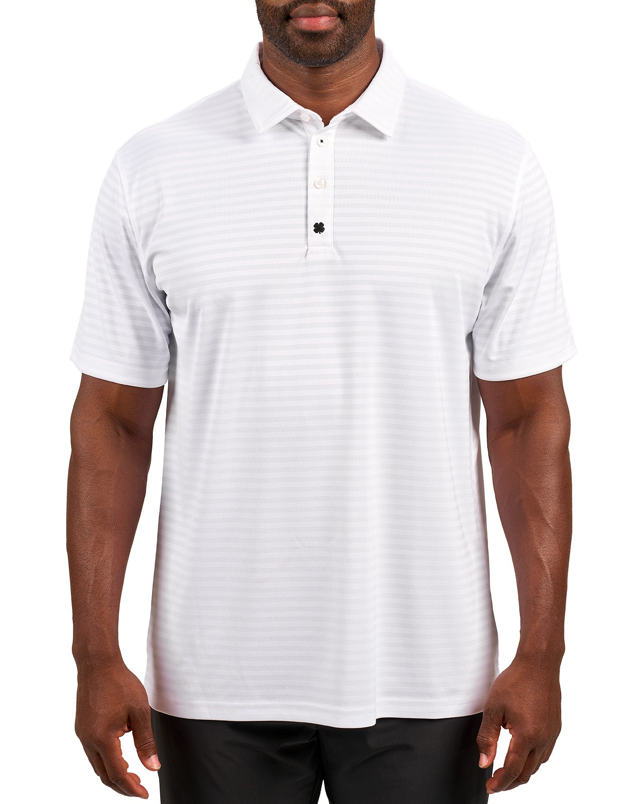 Man wearing striped white polo from Black Clover featuring small clover logo below the bottom button