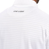 Man wearing striped white polo from Black Clover featuring small clover logo below the bottom button