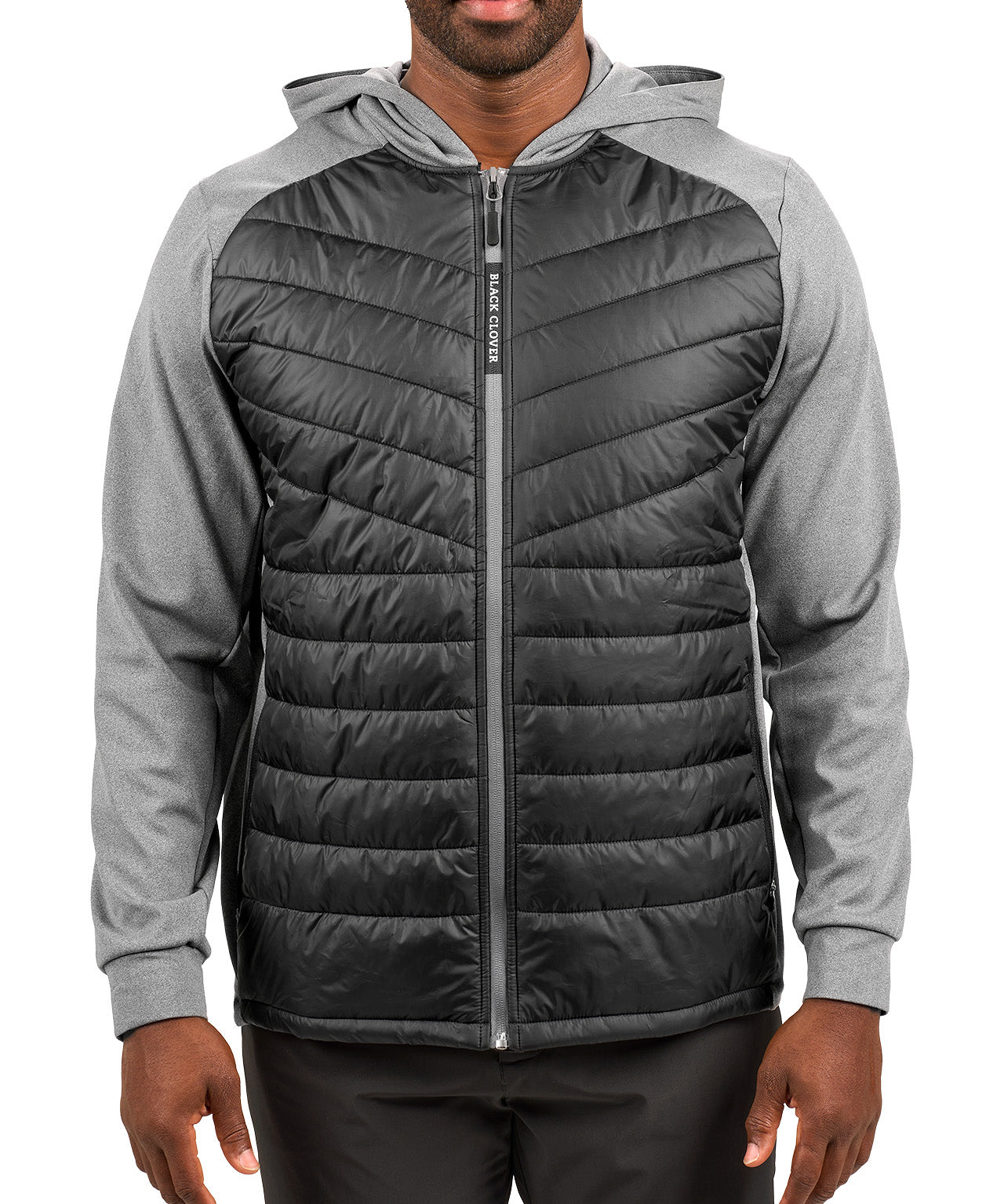 Man wearing black quilted jacket from Black Clover