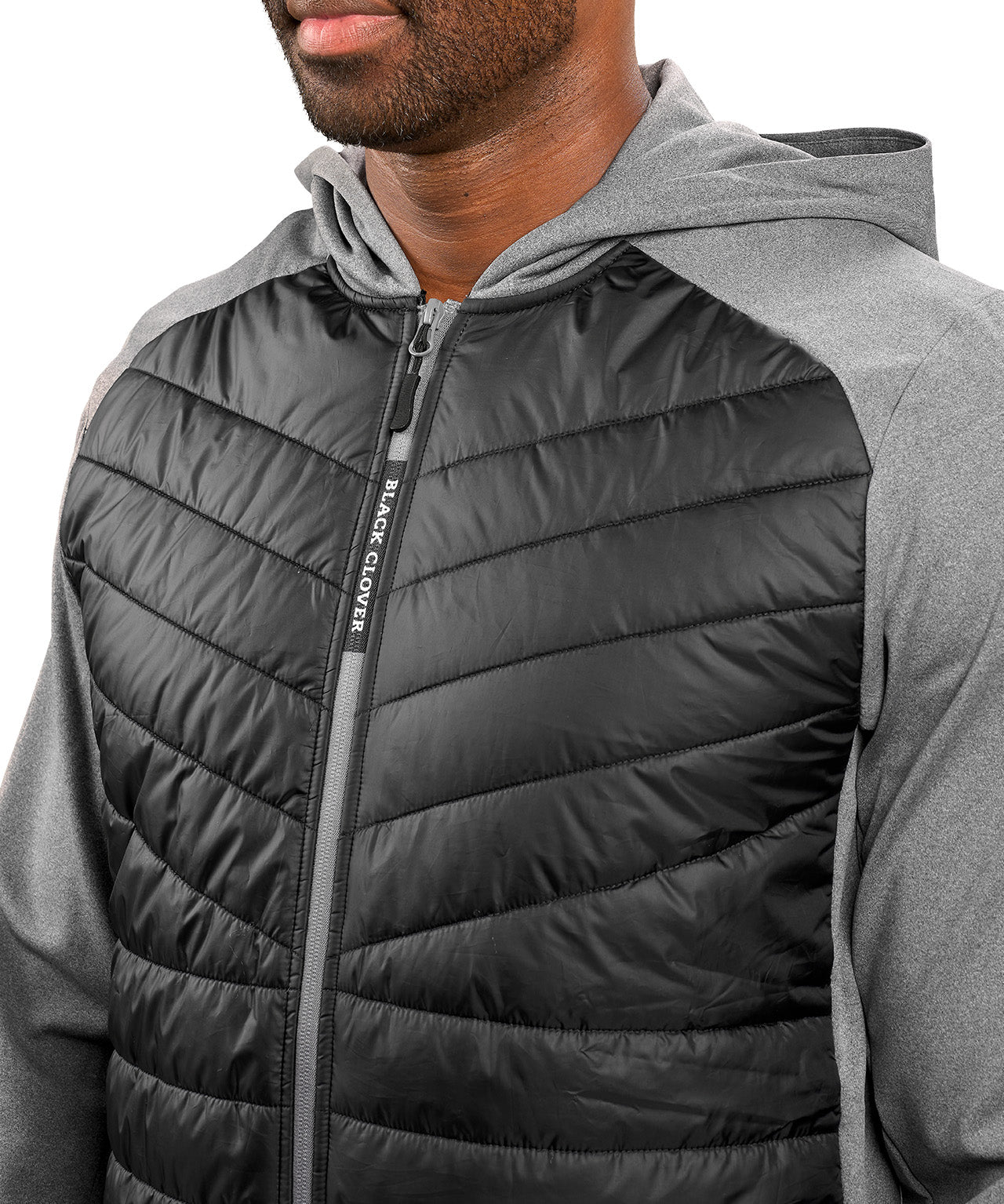 Man wearing black quilted jacket from Black Clover