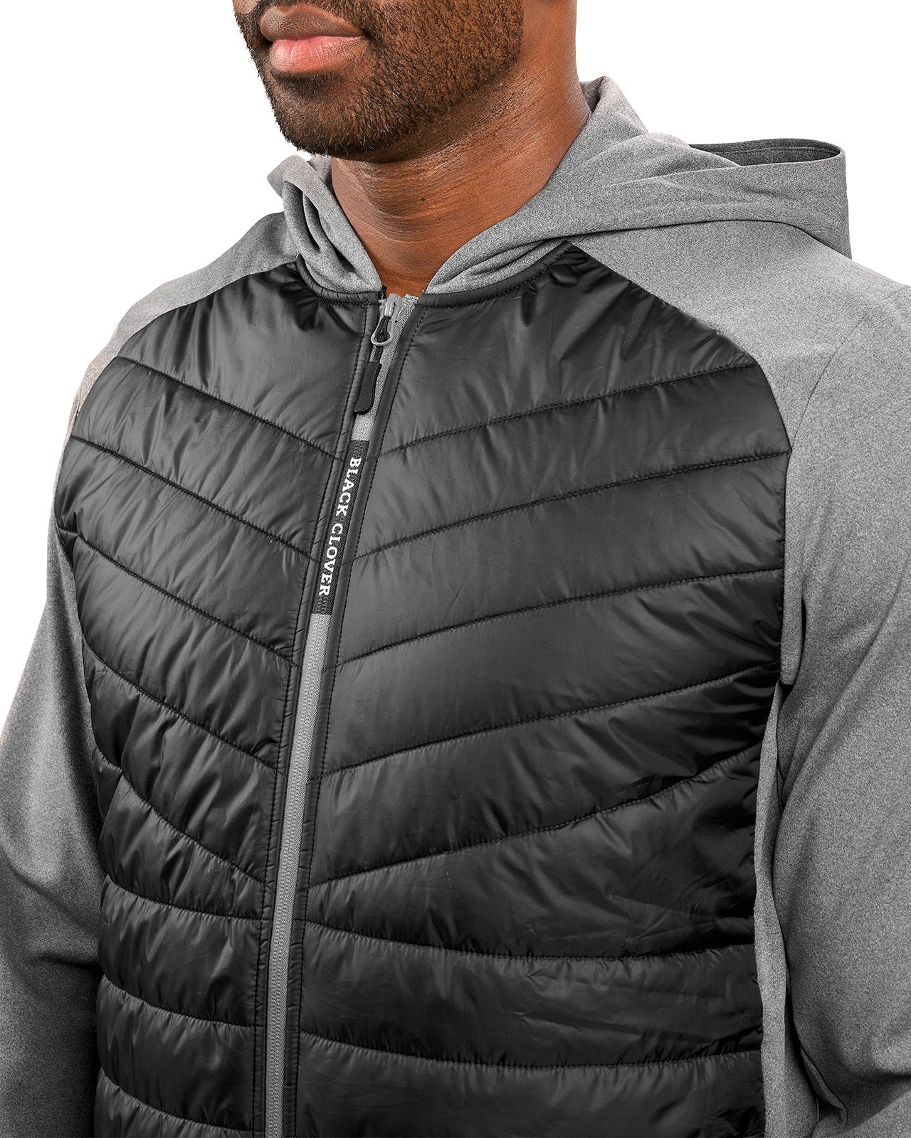 Man wearing black quilted jacket from Black Clover