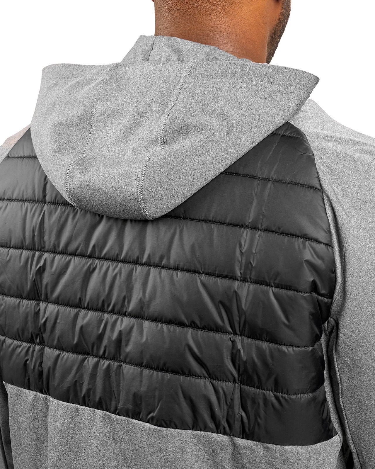 Man wearing black quilted jacket from Black Clover