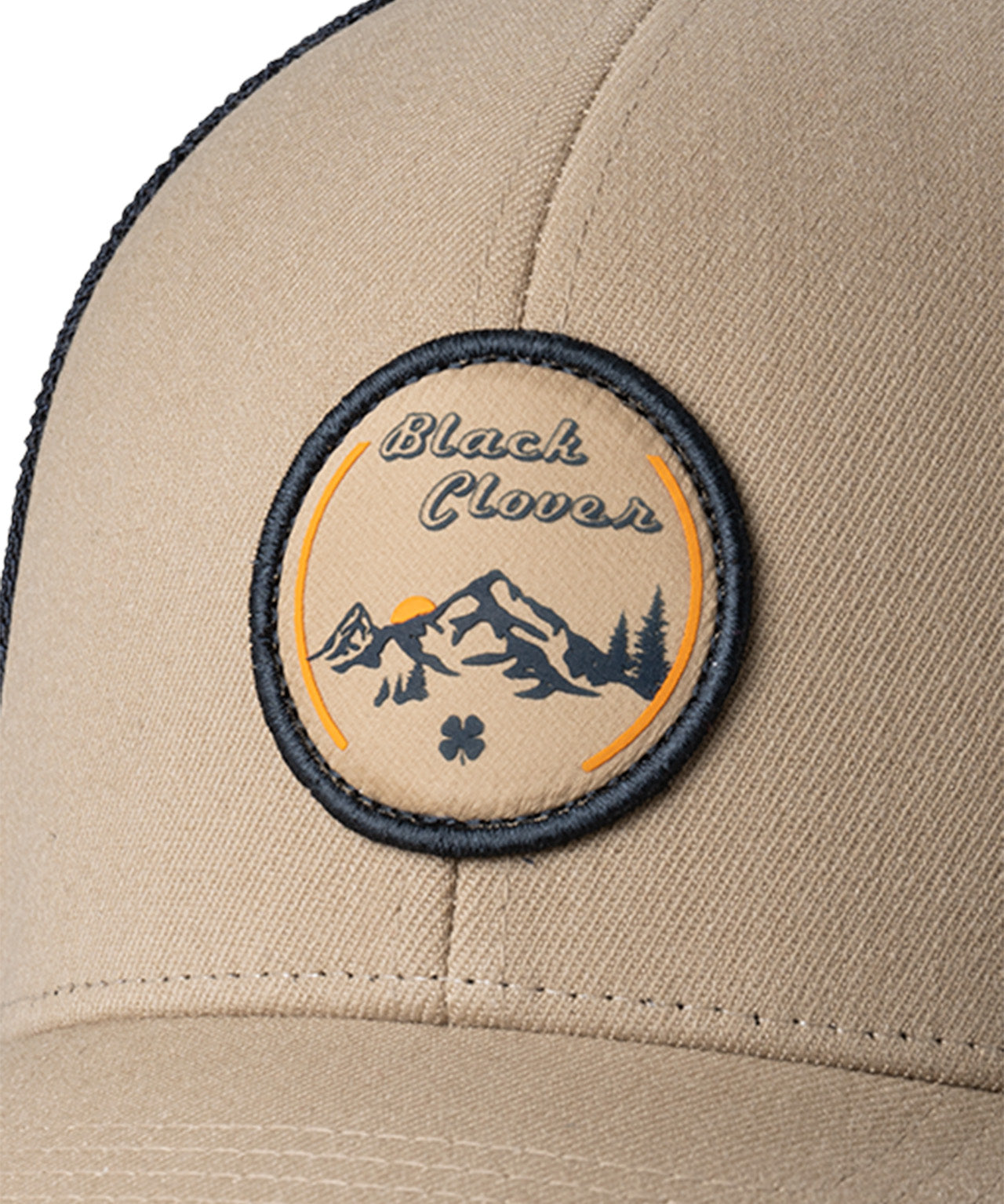 Brown hat with patch depicting Utah's cottonwood mountains