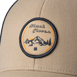 Brown hat with patch depicting Utah's cottonwood mountains