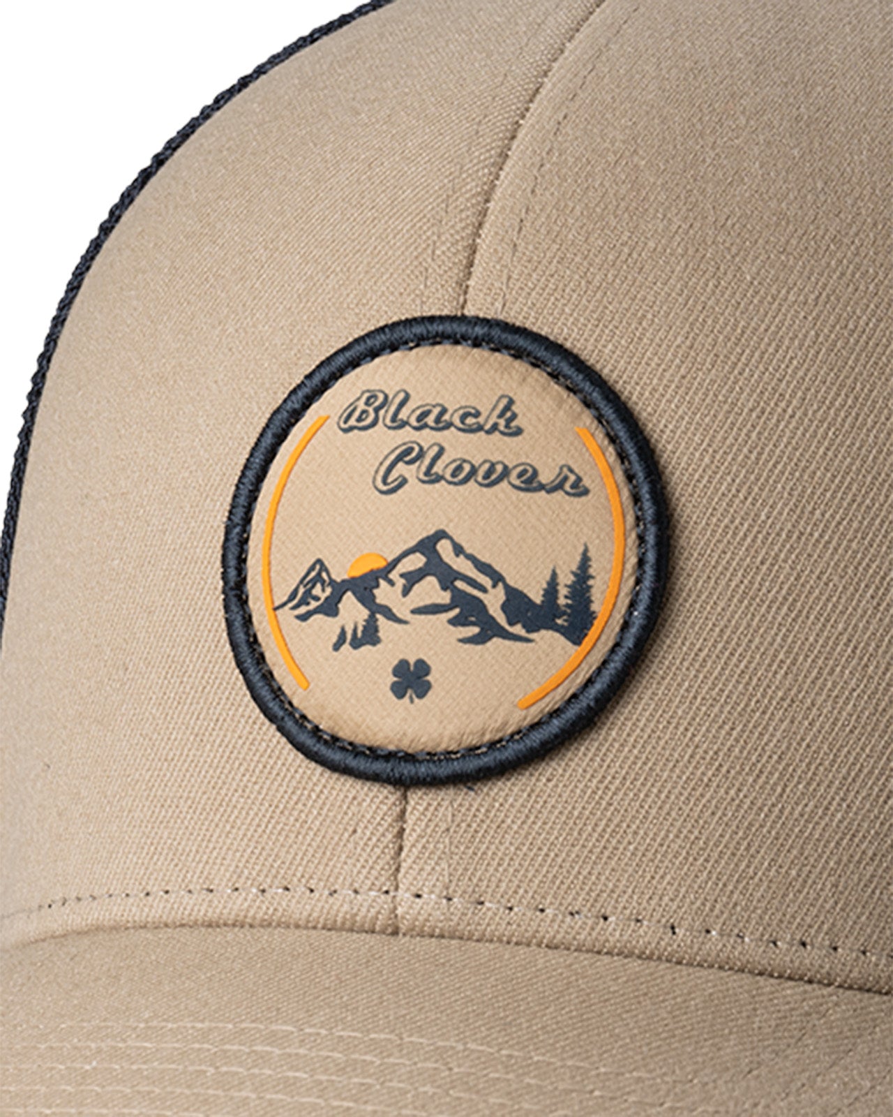 Brown hat with patch depicting Utah's cottonwood mountains