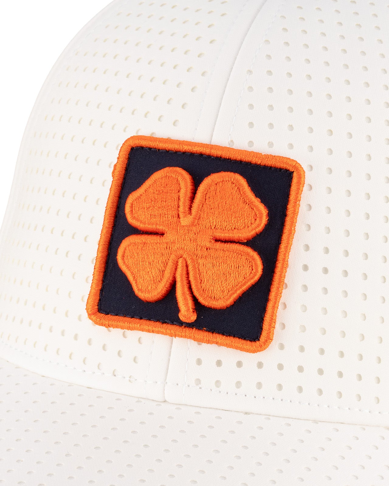 white perforated hat from Black Clover featuring University of Illinois Logo