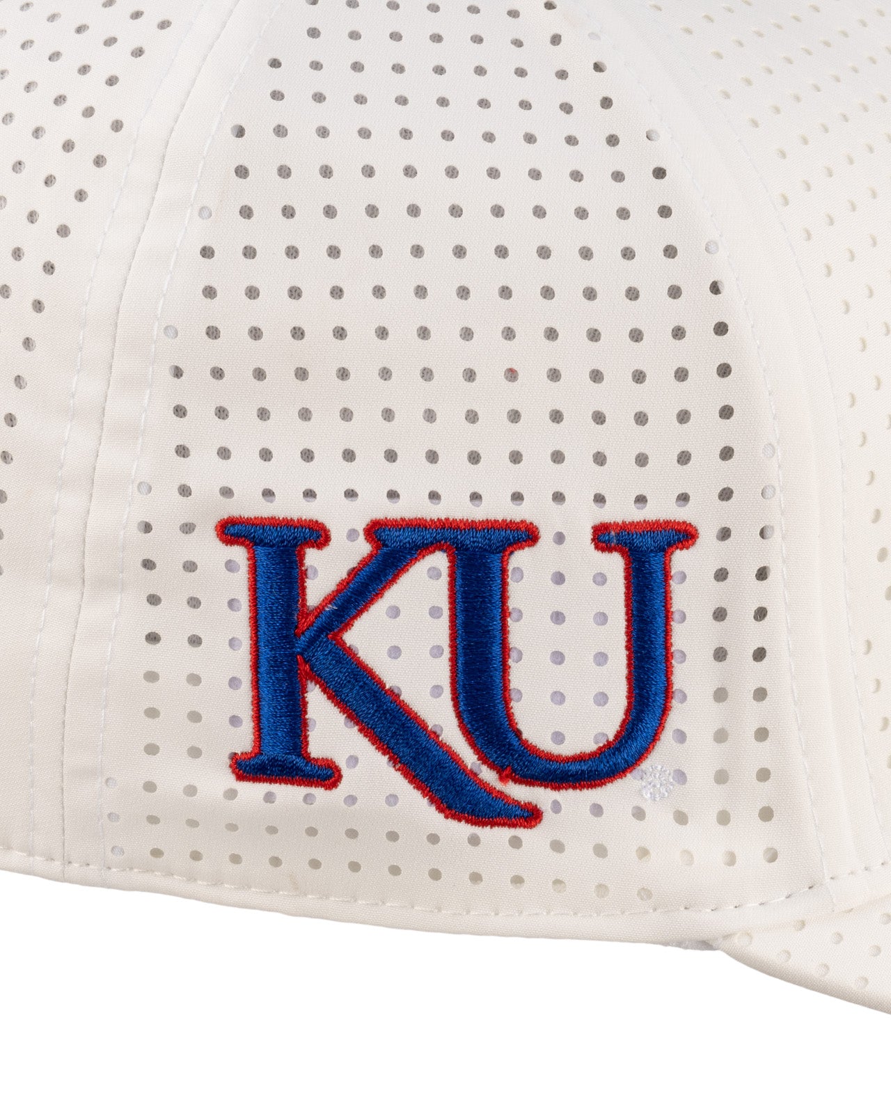 White perforated hat from Black Clover featuring the University of Kansas Jayhawks logo