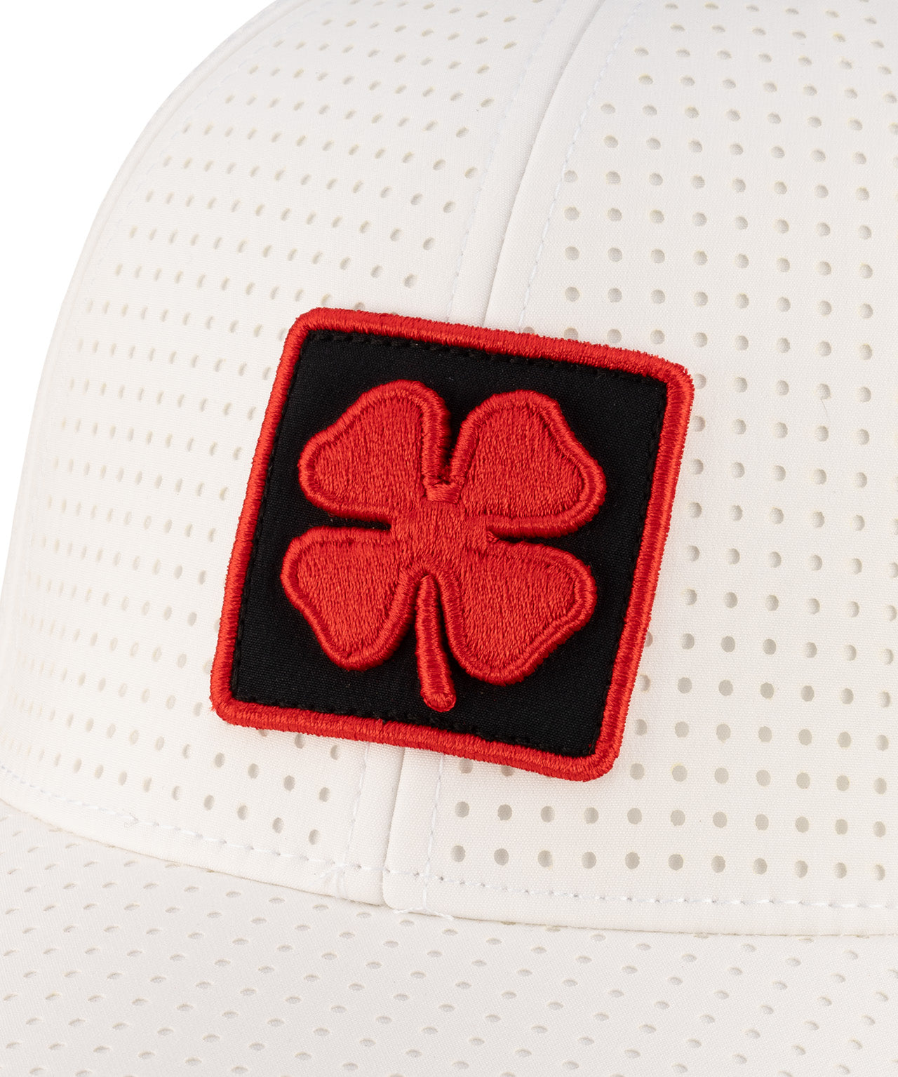 White perforated hat from Black Clover featuring University of Louisville Logo