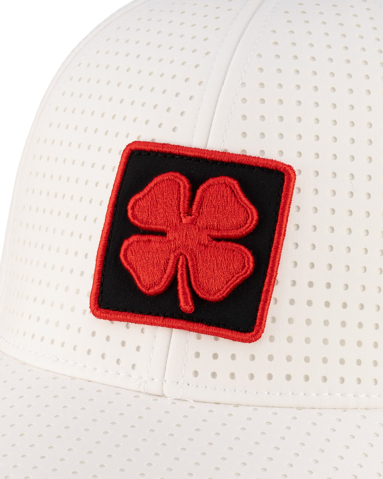 White perforated hat from Black Clover featuring University of Louisville Logo