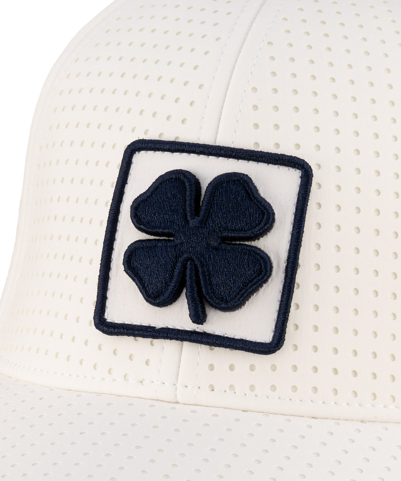 White perforated hat from Black Clover featuring University of Nevada Reno Wolfpack Logo