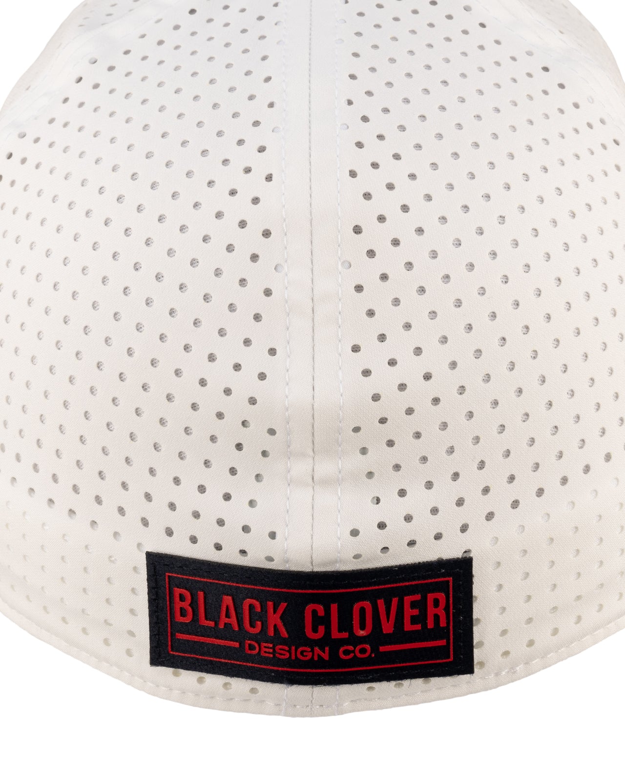 White perforated hat from Black Clover featuring Ole Miss logo