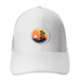 white hat with Black Clover patch depicting palm trees and surf boards on beach