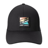 black hat with patch depicting palm leaves on retro colored background