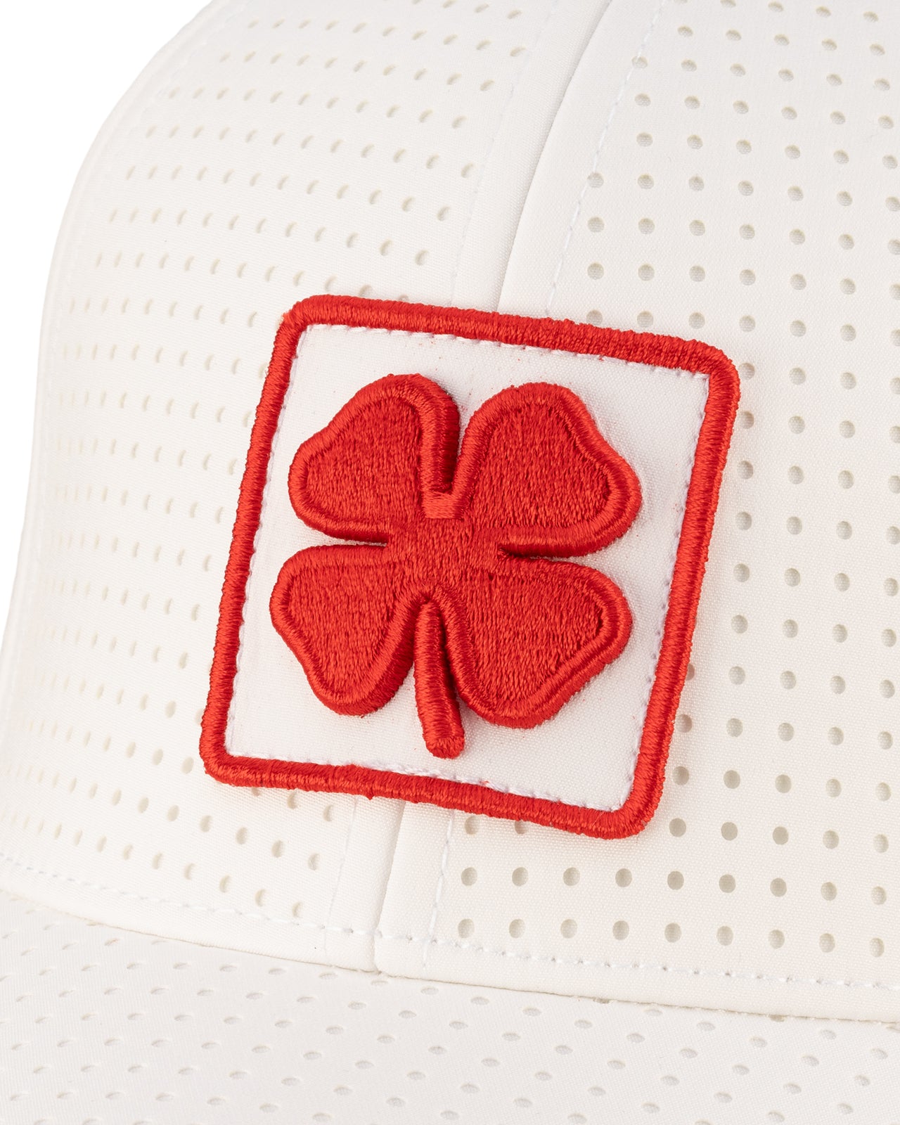 White perforated hat from Black Clover featuring Rutgers Scarlet Knights Logo