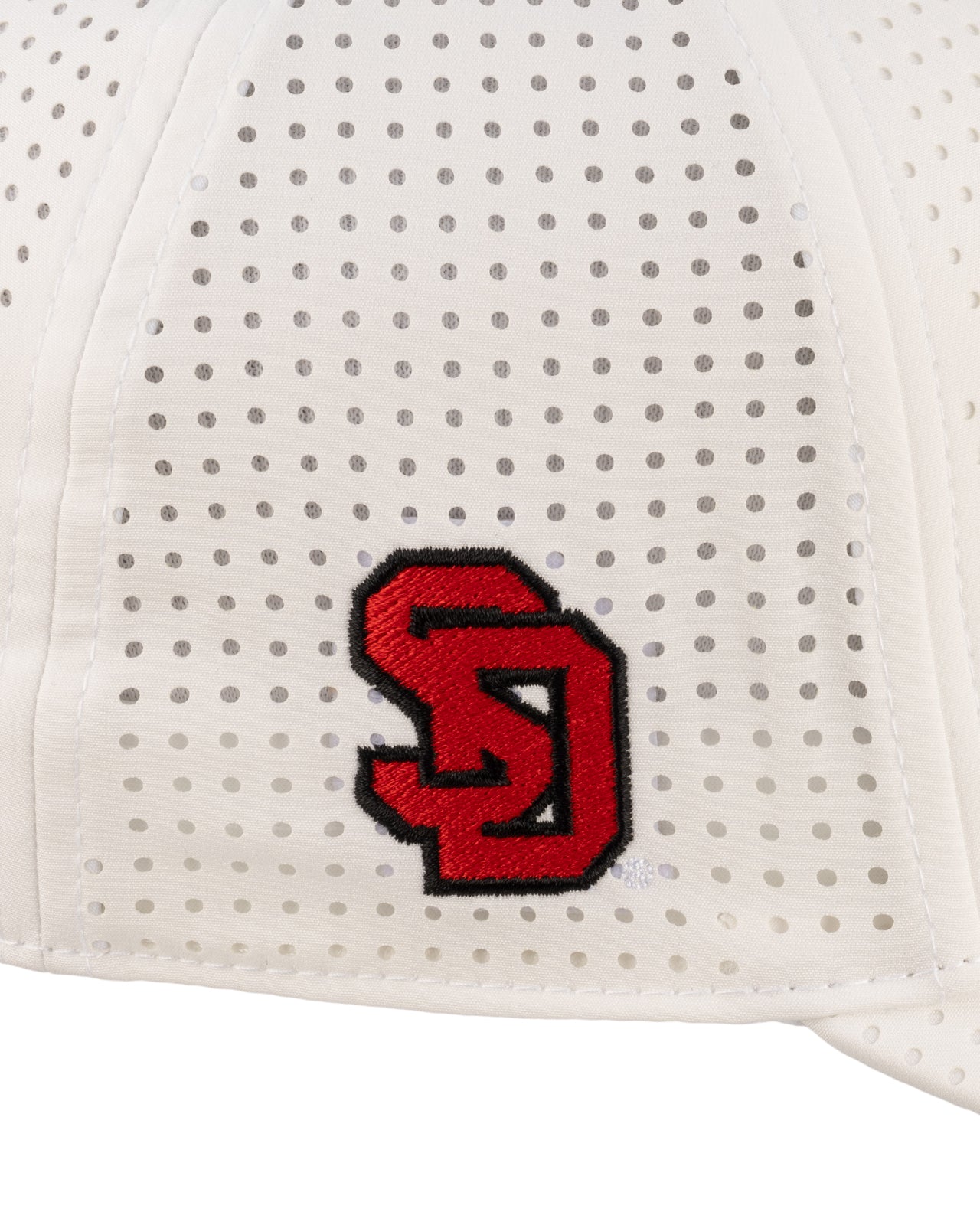 White perforated hat from Black Clover featuring South Dakota Coyotes logo