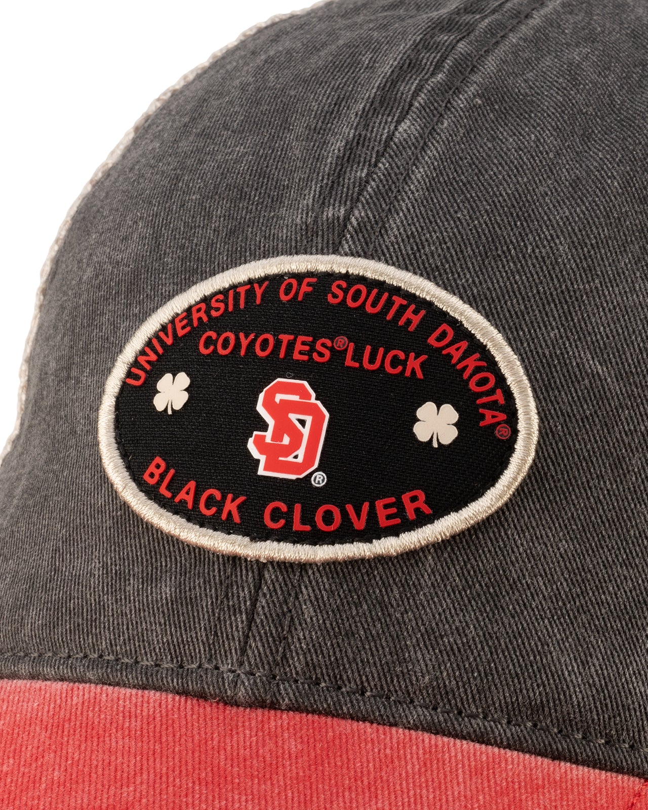 Red and black two tone vintage style hat from Black Clover featuring South Dakota Coyotes logo