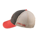 Red and black two tone vintage style hat from Black Clover featuring South Dakota Coyotes logo